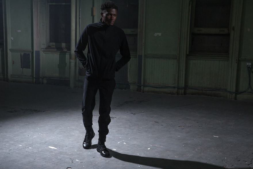 Outlier - Alphacharge Track Jacket (full body, moving forward)